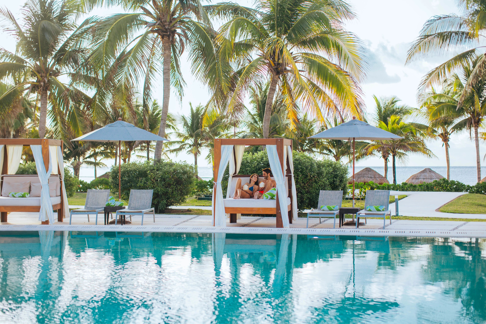 Pool with a cabana for couples at Dreams Puerto Morelos, Riviera Maya with Aquaterra Travels