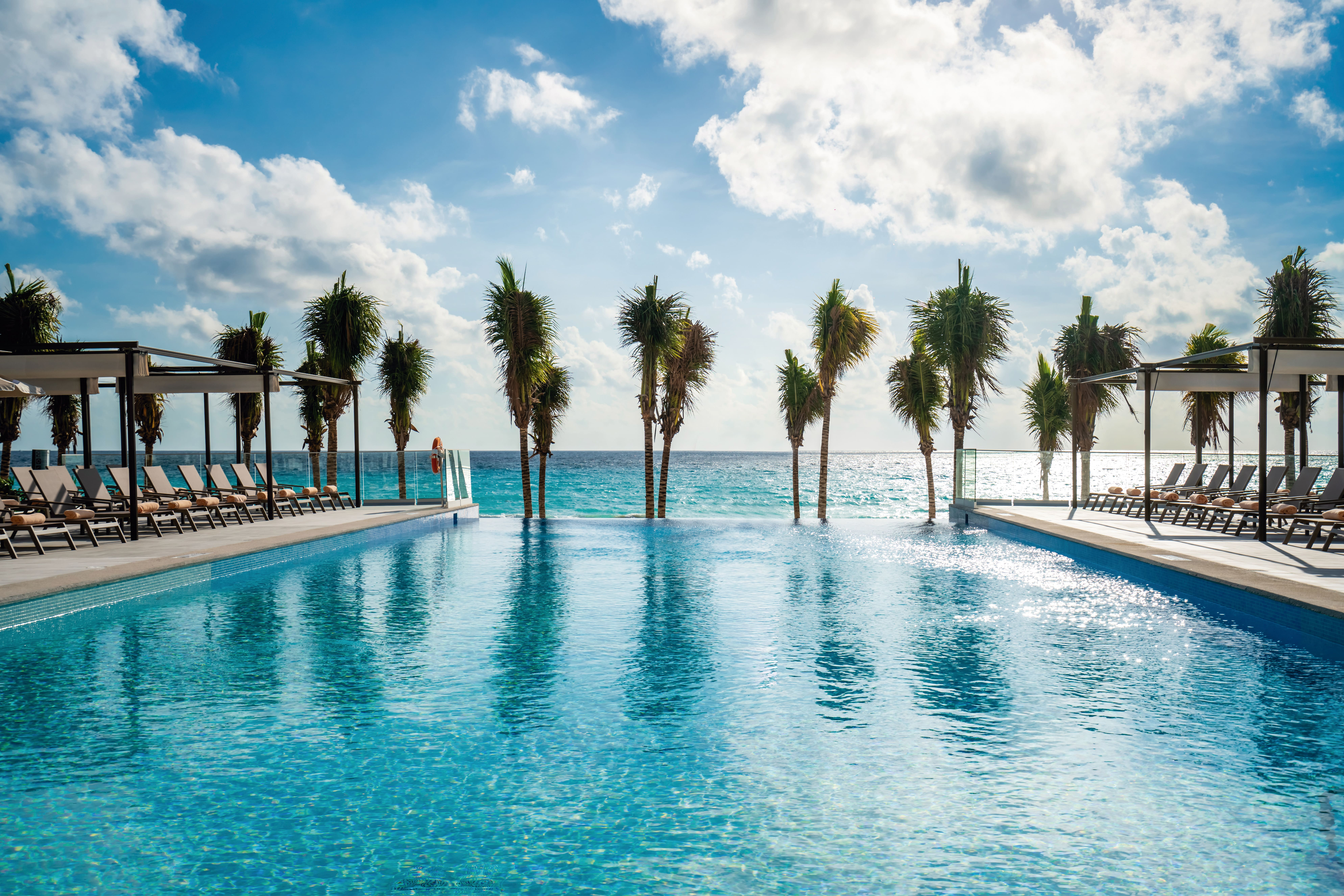 Riu Palace Kukulkan Cancun Hotel Zone Mexico Kukulkan Boulevard infinity pool with palm trees and sea views